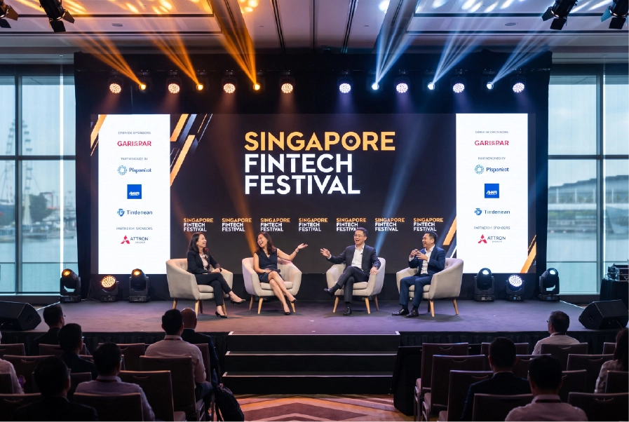 Conference stage with AV lighting and LED screen setup at a Singapore venue